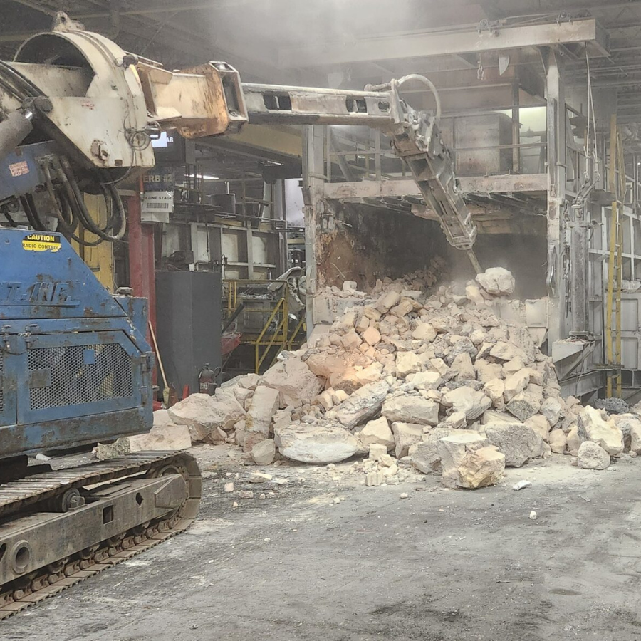 The Empire Solutions team demolishes an old furnace.