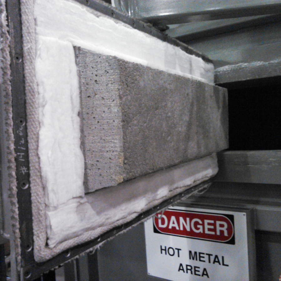 The door of a furnace is lined with plastic.