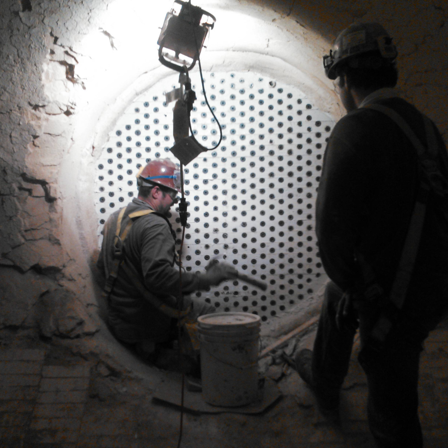 The Empire Solutions team applies plastic insulation.