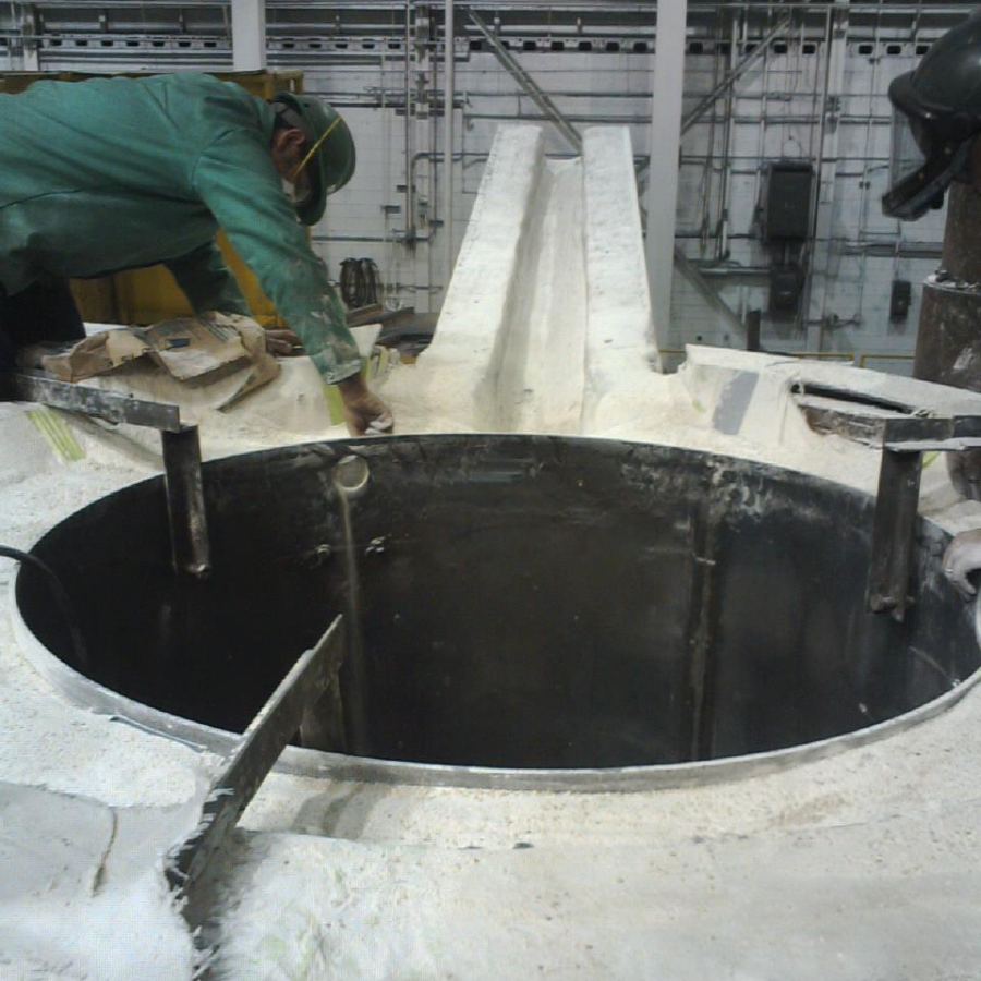 A Empire Solutions team member works to retrofit an old furnace.